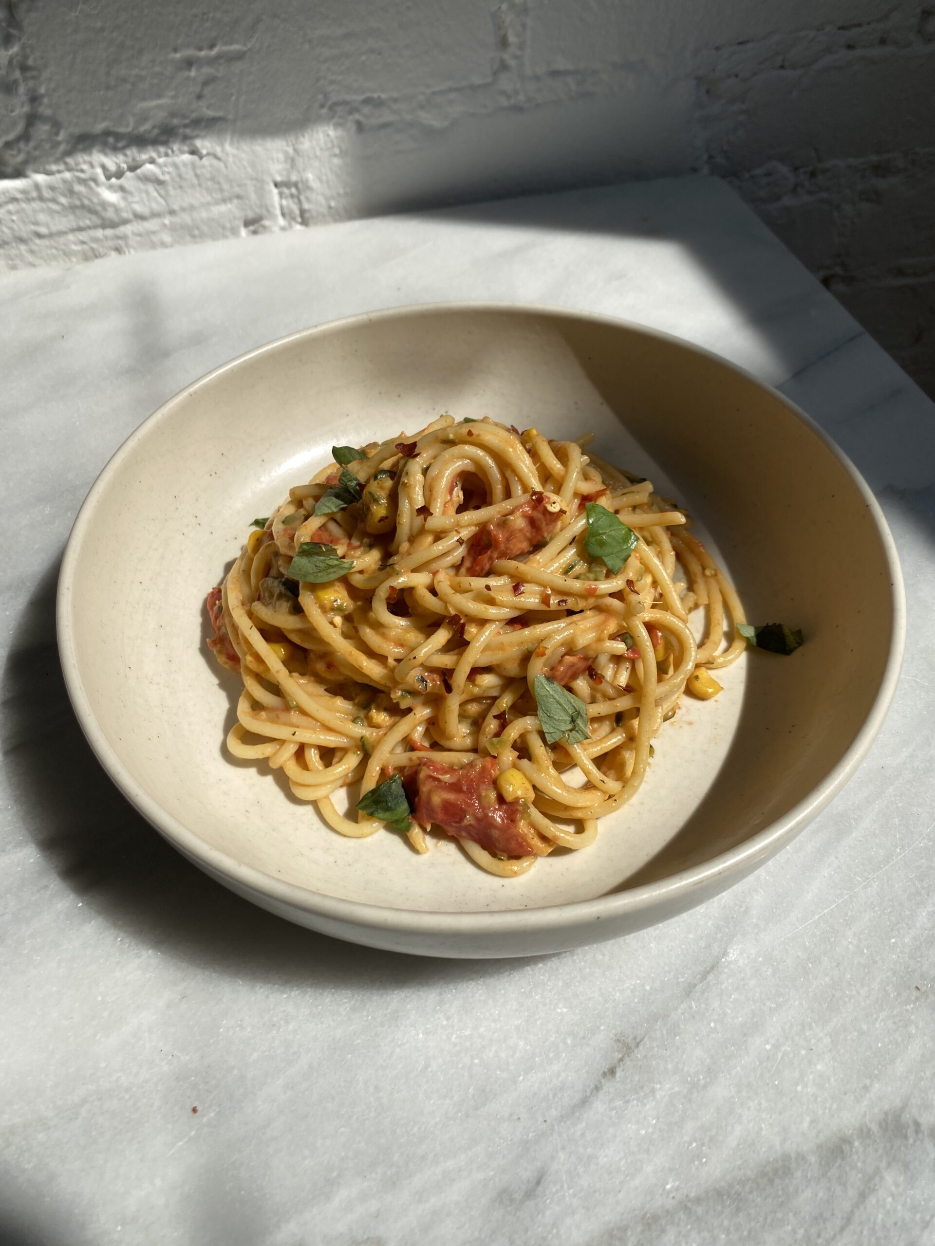 a bowl spaghetti tossed in creamy hidden veggie pasta sauce