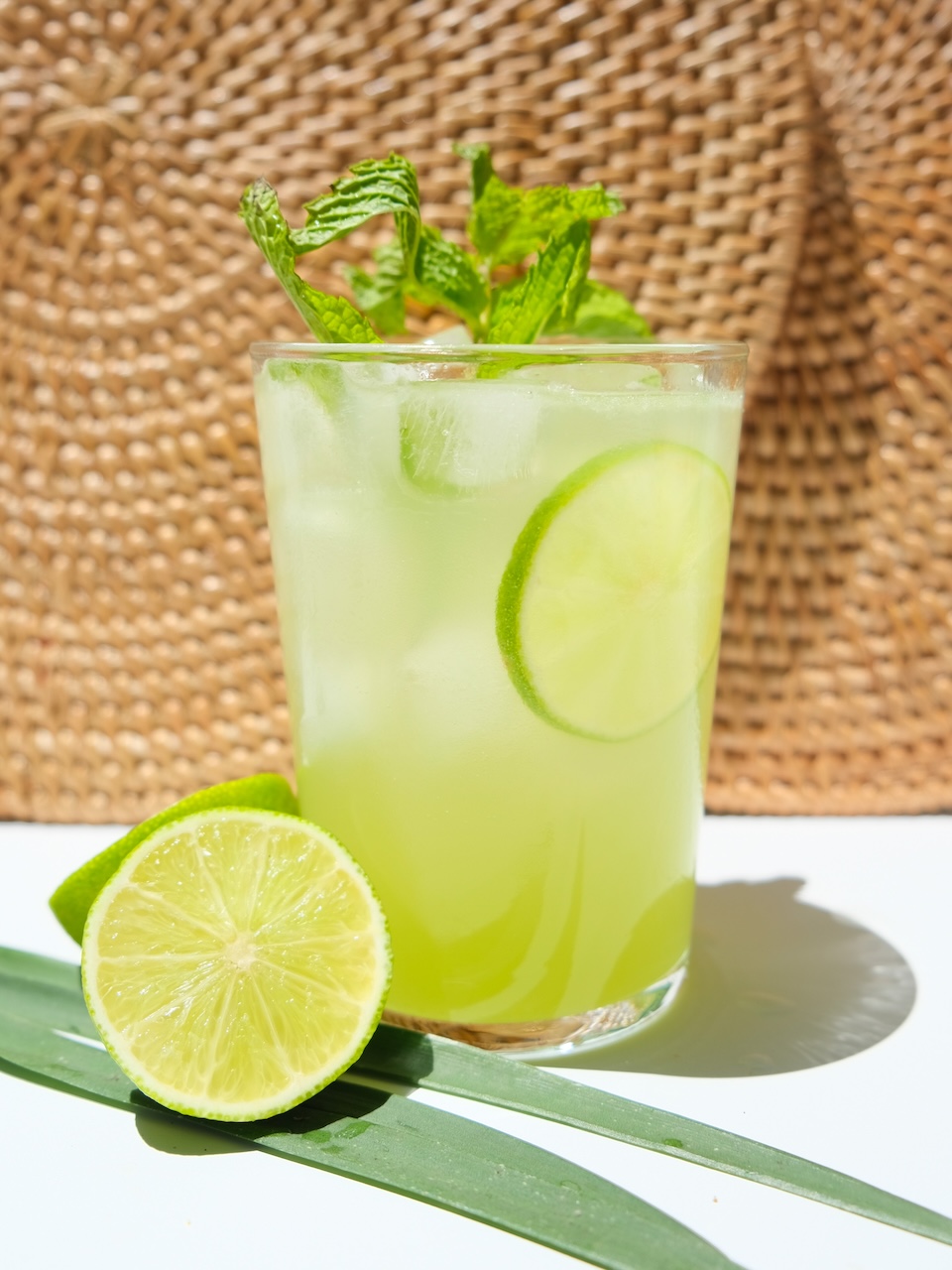 a single cucumber herb garden spritz in front of a wicker background